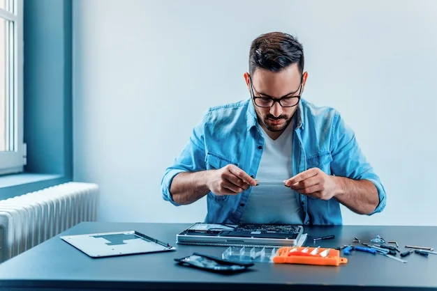 focused technician photographing disassembled laptop hardware 109710 91