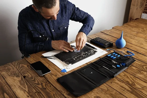 master uses small suction cup remove battery cells from broken laptop repair clean it his laboratory with special tools table around 346278 1803